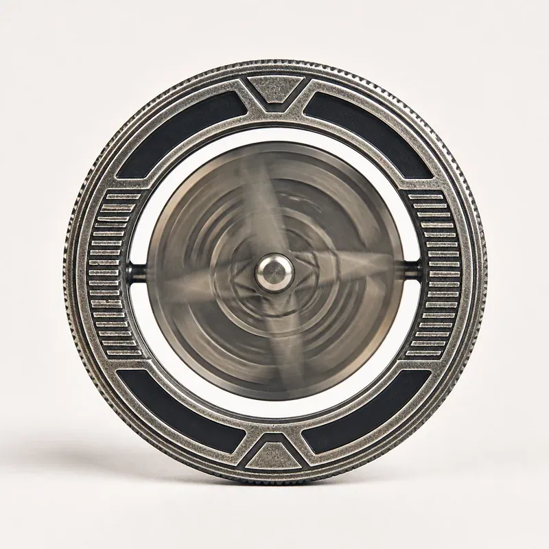 Spinner coin with rotating center mounted inside an outer ring