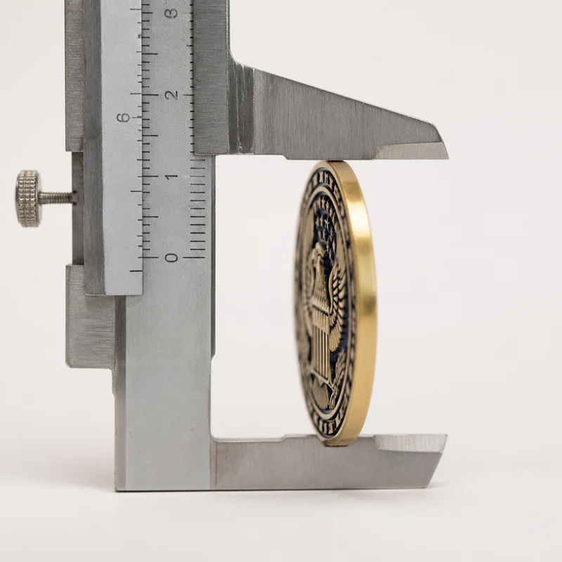 Standard-thickness coin measured with a caliper